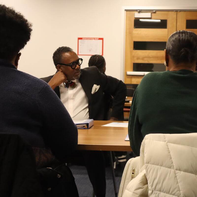 Leaders listening in group discussion