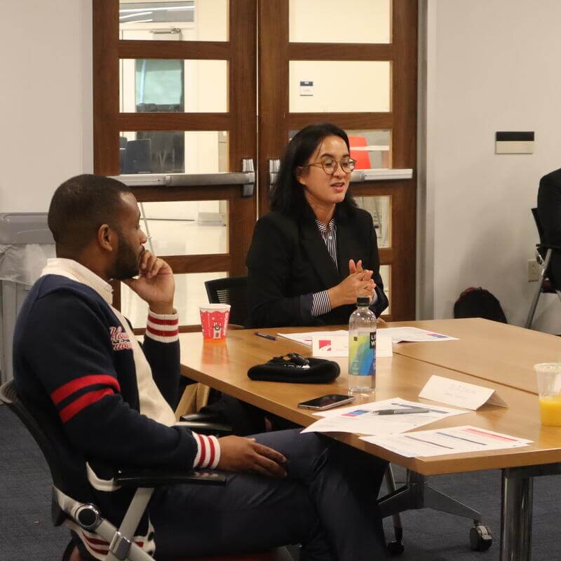 Leaders listening in group discussion
