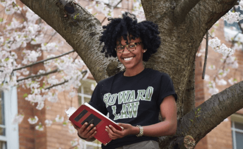 HU law student with book